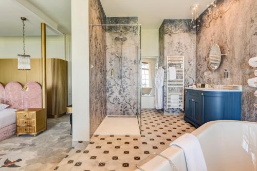 a bathroom with a tub and a shower stall at Château des Avenieres in Cruseilles