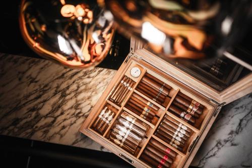 a table with a crate of wine bottles at Hotel Belvedere Locarno in Locarno