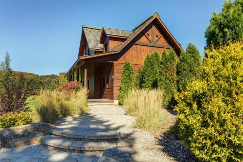 a home with a pathway leading to a house at Royal Laurentien in Mont-Blanc