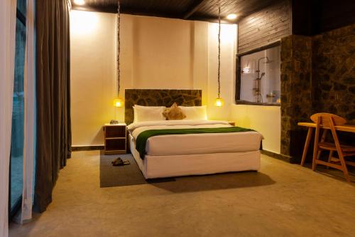 Postel nebo postele na pokoji v ubytování Grotta Resort