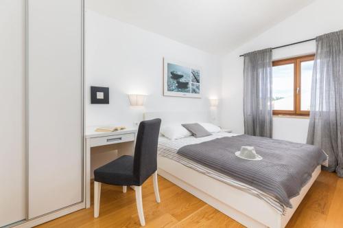 Postel nebo postele na pokoji v ubytování Villa Terra Grigia