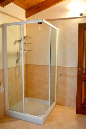 a shower with a glass enclosure in a bathroom at Agriturismo Colle Mura in Morano Madonnuccia