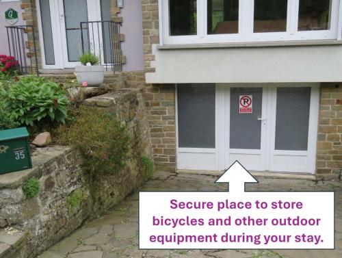 a house with a door to storebubbles and other outdoor equipment during your stay at Les Gites Kangourou Dinant in Dinant
