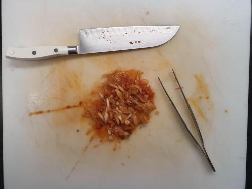 a knife and some food on a white table at Casa Gatti BnB Gastronomia e Benessere in Motto
