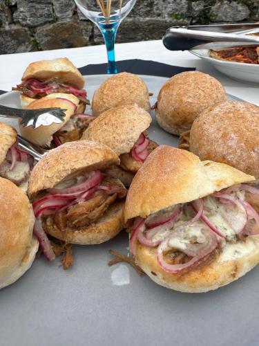 a bunch of sandwiches on a plate on a table at Casa Gatti BnB Gastronomia e Benessere in Motto