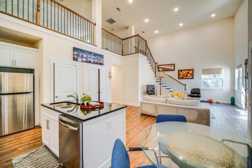 a kitchen and living room with a table and a couch at Walk to Historic Dtwn McKinney Family Retreat in McKinney