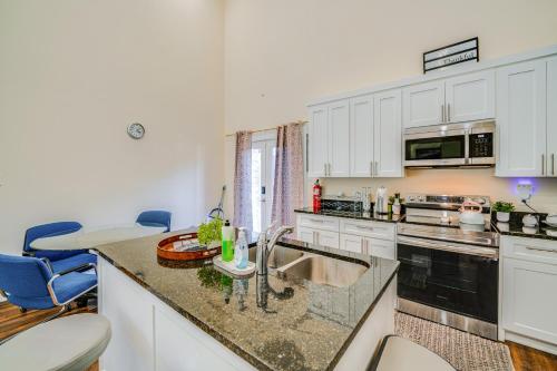 a kitchen with white cabinets and a counter top at Walk to Historic Dtwn McKinney Family Retreat in McKinney