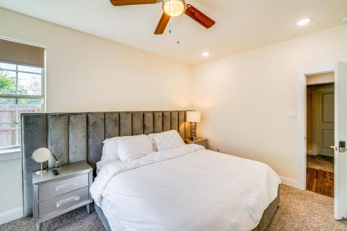 a bedroom with a large bed and a ceiling fan at Walk to Historic Dtwn McKinney Family Retreat in McKinney