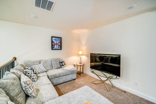 a living room with a couch and a fireplace at Walk to Historic Dtwn McKinney Family Retreat in McKinney