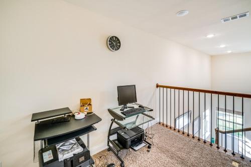 an office with a desk and a computer on a wall at Walk to Historic Dtwn McKinney Family Retreat in McKinney