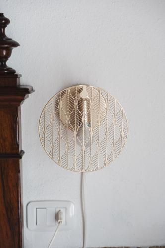 a lamp with a plate on top of it at Villa San Giusto - Pool&Relax in Montemassi