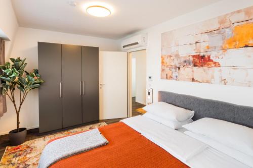 Postel nebo postele na pokoji v ubytování URBAN ISLAND I Riverside Apartments