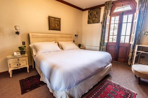 Una cama o camas en una habitación de Gervasoni Hotel Boutique