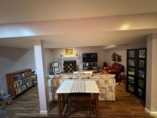 a living room with a couch and a table at Fenton Oasis in Fenton