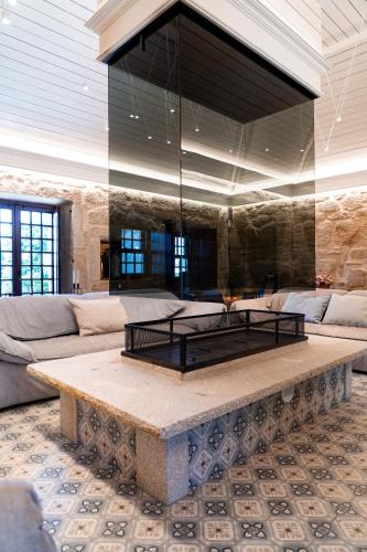 a living room with a couch and a table at Vinte-Quinta da Boavista in Ponte de Lima