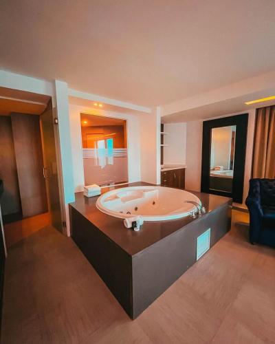 Ένα ή περισσότερα κρεβάτια σε δωμάτιο στο Tibisay Hotel Boutique Margarita