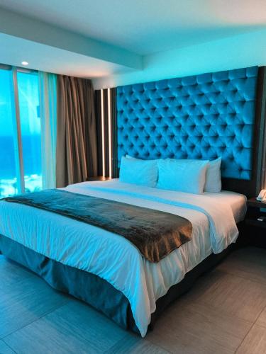 Ένα ή περισσότερα κρεβάτια σε δωμάτιο στο Tibisay Hotel Boutique Margarita