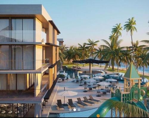 a resort with a swimming pool and a resort at Porto Alto Resort in Ipojuca
