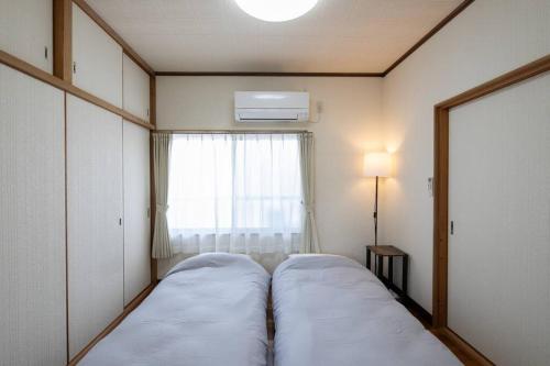House in Tenjinzakiにあるベッド