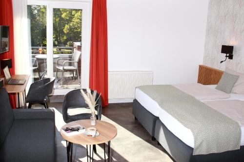 Postel nebo postele na pokoji v ubytování Hotel Quellenhof