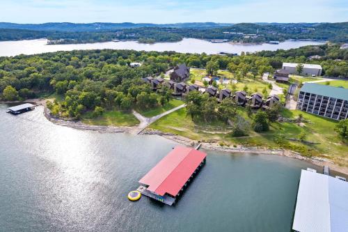 an aerial view of a house on an island in the water at Worth the Wake in Branson