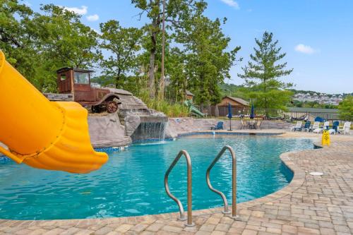 a slide in a swimming pool in a park at Worth the Wake in Branson