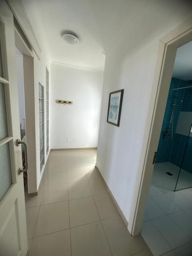 a hallway with a walk in shower and a walk in shower at Casa Adriana in Costa Calma