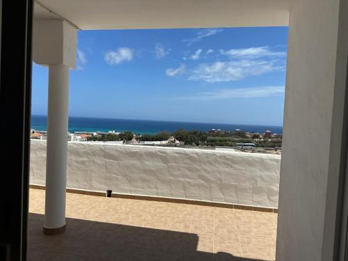 a view of the ocean from a balcony at Casa Adriana in Costa Calma
