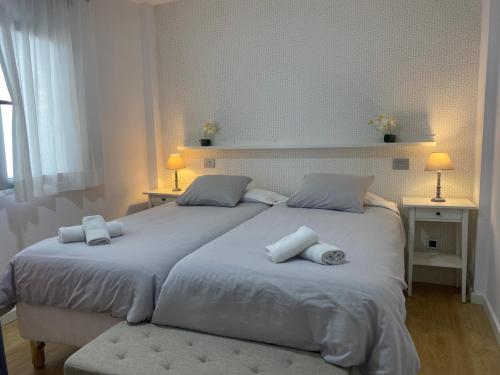 A bed or beds in a room at Mar y Playa de Martín, 2B