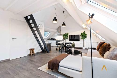 a bedroom with a bed and a living room at Charming 1BR Loft in Ville-Haute, Luxembourg in Luxembourg