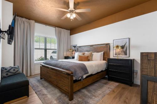 a bedroom with a large bed and a ceiling fan at Breathtaking Lake Views-Dog Friendly-$400 of Free Tickets-High End Decor in Branson