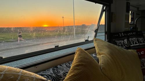a view of the sunset from the inside of a bus at Cool Wheels on the Waterfront in Liverpool
