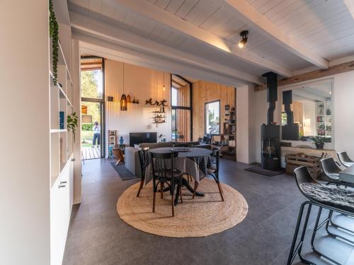 a kitchen and dining room with a table and chairs at Oasis de verdure en Périgord - vue imprenable in Lamonzie-Montastruc