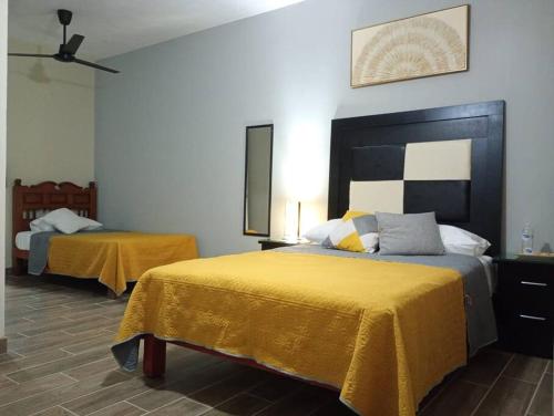 Una cama o camas en una habitación de BlueHouse