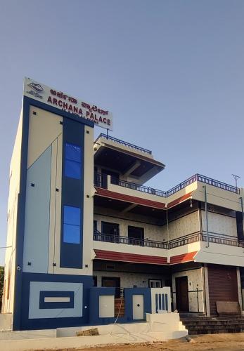 a building with an americana park sign on it at Archana palace hampi in Hampi