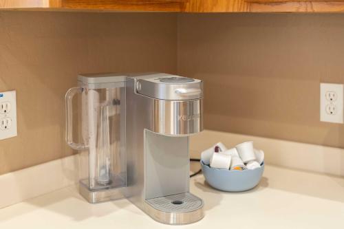a food processor on a counter with a bowl of sugar at Sunny Home with Backyard Oasis in San Tan Valley! in Queen Creek