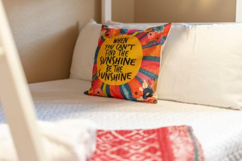 a pillow sitting on top of a bed at Sunny Home with Backyard Oasis in San Tan Valley! in Queen Creek