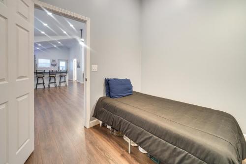 a room with a bed in the middle of a room at Near Kanawha River Unique Renovated Home with Yard! in Glen Ferris