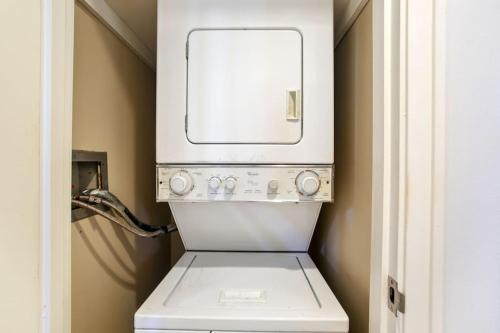 a white washer and dryer in a bathroom at Gorgeous Kapalua Home with Views in Kahana