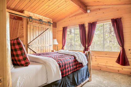 a bedroom with a bed in a log cabin at The Lions Den in Big Bear City