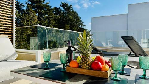 a bowl of fruit on a table on a patio at Luxury Paradise Villa in Paphos
