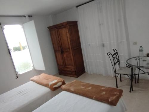 Postel nebo postele na pokoji v ubytování Habitaciones Los Semellones