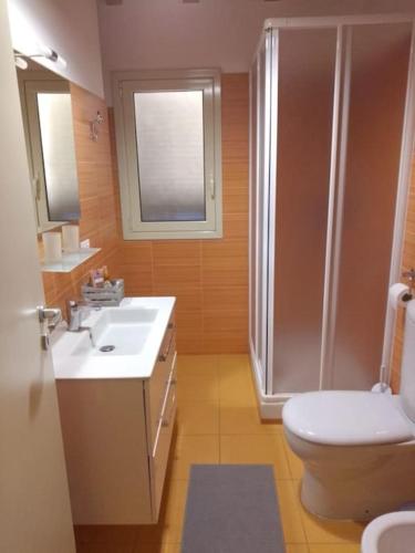 a bathroom with a shower and a toilet and a sink at casa vacanza suite Etna-Mare in Zafferana Etnea
