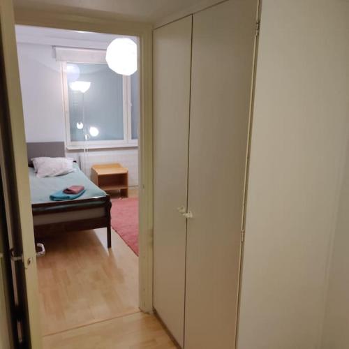 a room with a bedroom with a bed and a window at Nice 3-room-apartment next to Old Rauma & stadiums in Rauma