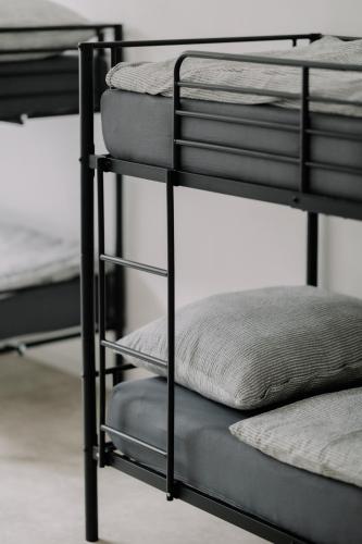 a group of bunk beds in a room at Továrna Vír in Vír