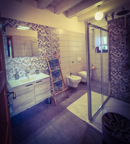 a bathroom with a shower and a sink and a toilet at Casa Kapusta, Hidden gem in nature, Swimming poll, Jacuzzi, Fire Pit in Ogulin
