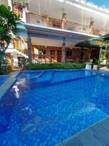 La alberca dentro o cerca de Homestay Joglo Seruni Syariah