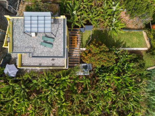 an overhead view of a house with a solar array on the roof at Sky & Ocean in Calheta
