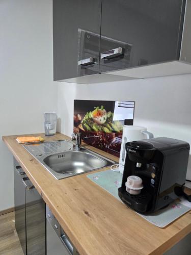 Kuchyň nebo kuchyňský kout v ubytování Kempf Apartments