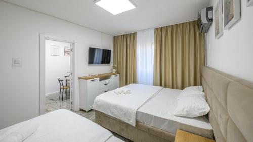 Postel nebo postele na pokoji v ubytování NAŠ Apartman